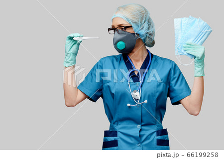 female doctor with stethoscope wearing protective mask and latex gloves over light grey background holding thermometer 66199258