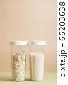 Plastic containers with cereals. Home storage products. Rice and oat. 66203638