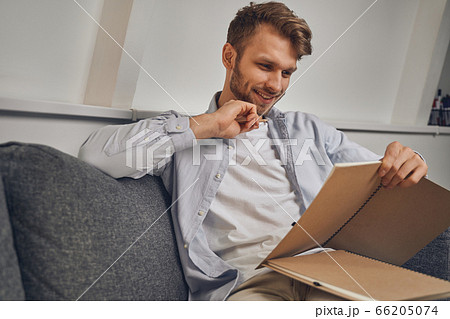 Attractive businessman with a pencil and notebook Attractive businessman with a pencil and notebook 66205074