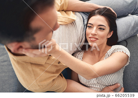 Happy married couple spending leisure time together indoors Happy married couple spending leisure time together indoors 66205539