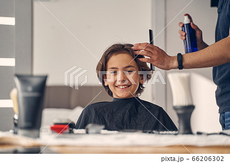 Little Caucasian child looking happy before haircut Little Caucasian child looking happy before haircut 66206302