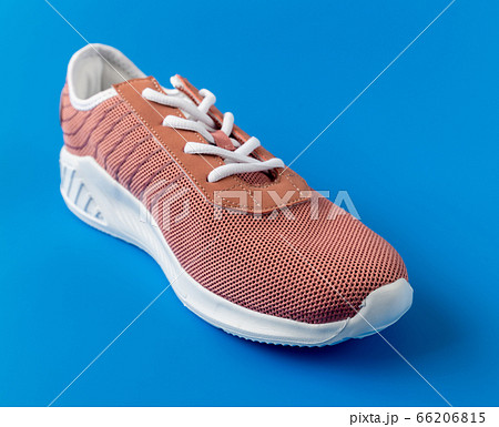 Brown textile sneakers on a blue background. 66206815