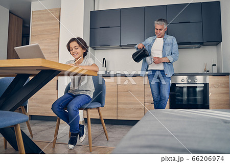 Two family members enjoying comfort of home 66206974