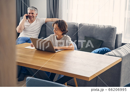 Two smiling family members staying inside together 66206995