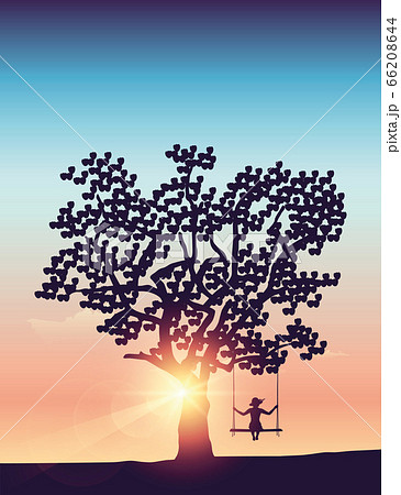 girl on a swing under a big tree at sunset 66208644