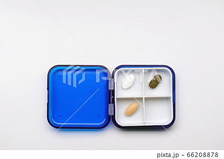 The photo shows a box with different capsules and tablets The photo shows a box with different capsules and tablets 66208878