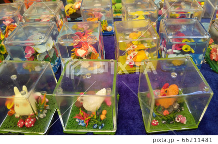 KUALA LUMPUR, MALAYSIA -SEPTEMBER 23, 2016: Miniature models and cartoon characters are made using plastic clay and placed in perspex containers. KUALA LUMPUR, MALAYSIA -SEPTEMBER 23, 2016: Miniature models and cartoon characters are made using plastic clay and placed in perspex containers. 66211481