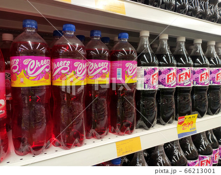 KUALA LUMPUR, MALAYSIA -MAY 17, 2020: Soft drinks or carbonated drinks arranged and stacked on the rack inside the huge supermarket for sale. Sorted by the brand to make easy for the customer to buy 66213001