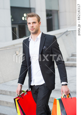 Man stylist professional shopper. Clothes courier. Man stylist professional shopper. Clothes courier. 66216317