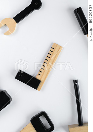 Children wooden instruments on a white background, engineering corner in the center of the composition. The concept of diy Children wooden instruments on a white background, engineering corner in the center of the composition. The concept of diy 66220357