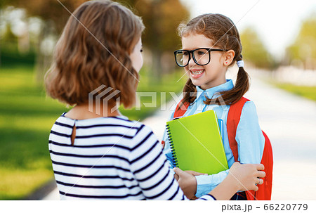 first day at school. mother leads  little child 66220779