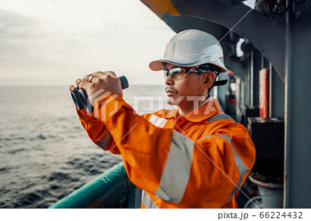 Filipino deck Officer on deck of vessel or ship , wearing PPE personal protective equipment Filipino deck Officer on deck of vessel or ship , wearing PPE personal protective equipment 66224432