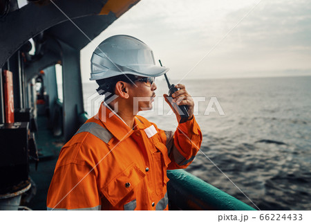 Filipino deck Officer on deck of vessel or ship , wearing PPE personal protective equipment 66224433