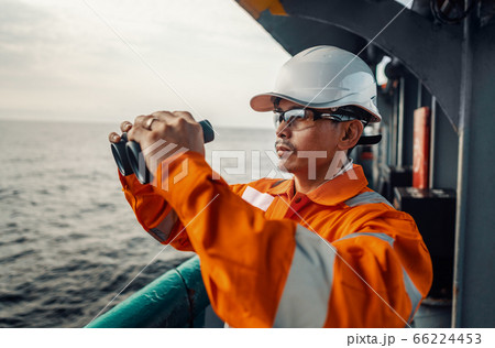 Filipino deck Officer on deck of vessel or ship , wearing PPE personal protective equipment 66224453