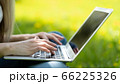 Close-up of female hand typing on laptop 66225326