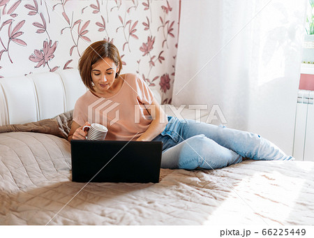 Working young brunette woman freelancer at home 66225449