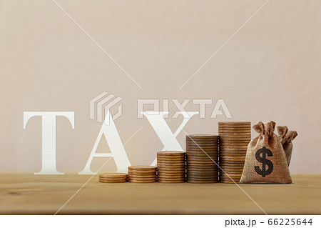 Finance tax concept: US dollar bags with rising coins, word tax on wood table. depicts ad valorem tax on the value of the property all legitimately Finance tax concept: US dollar bags with rising coins, word tax on wood table. depicts ad valorem tax on the value of the property all legitimately 66225644