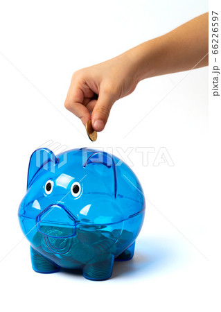 blue piggy bank hand putting coin into on white blue piggy bank hand putting coin into on white 66226597