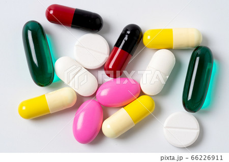 Assorted pills multicolored isolated. 66226911