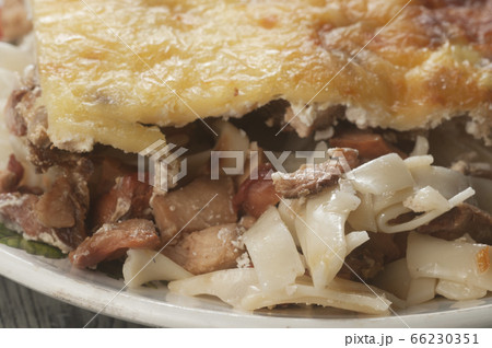 Pudding with musrooms, pasta and cheese Pudding with musrooms, pasta and cheese 66230351