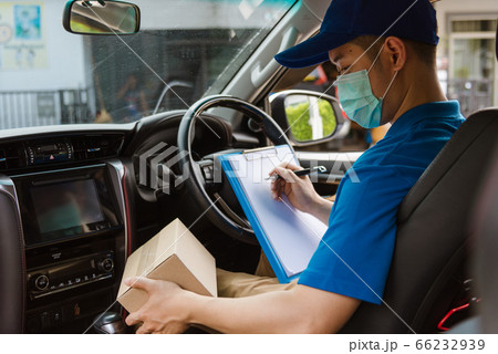 delivery courier young man driver inside the van 66232939