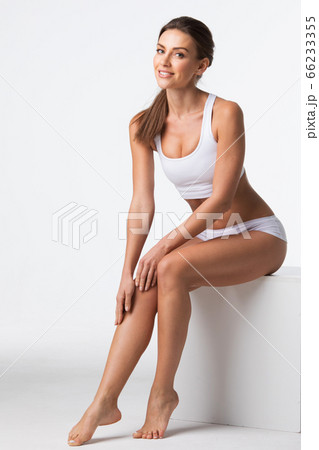 Woman in underwear touch legs 66233355
