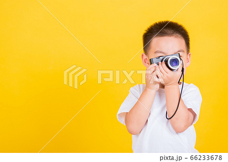 child boy hold photo camera compact doing taking child boy hold photo camera compact doing taking 66233678