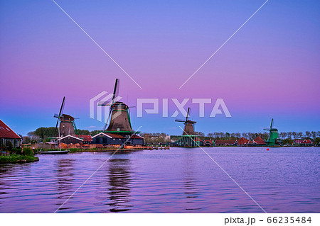 Windmills at Zaanse Schans in Holland in twilight on sunset. Zaa 66235484