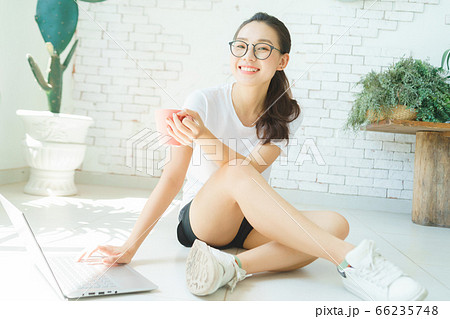 A beautiful woman using laptop at home in morning A beautiful woman using laptop at home in morning 66235748