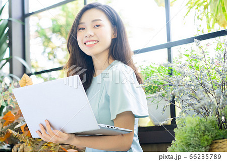 A beautiful woman working at coffee shop 66235789