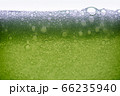 Background of close-up soda bubbles mixed with lemon juice or green juice on white background. 66235940
