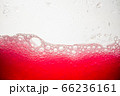 Background of close-up soda bubbles mixed with red fruit juice on white background. 66236161