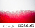 Background of close-up soda bubbles mixed with red fruit juice on white background. 66236163