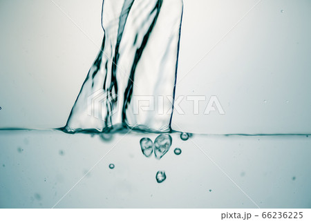 Background of pure water is pouring with bubbles. Background of pure water is pouring with bubbles. 66236225