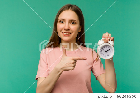 Image of cheerful female student standing isolated 66246500