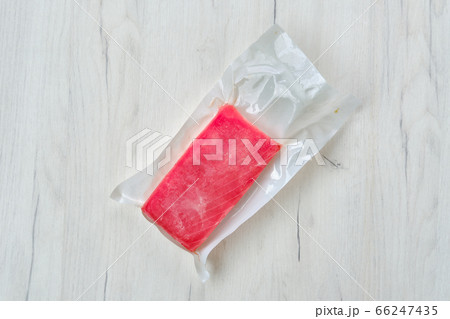 Raw frozen tuna fillet in vacuum packaging on Raw frozen tuna fillet in vacuum packaging on 66247435