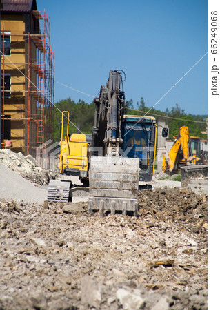 A large construction excavator of yellow color 66249068