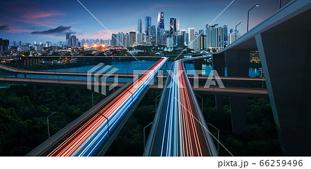 Highway with vehicle light trails leading to Highway with vehicle light trails leading to 66259496