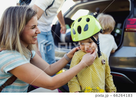 Family with two small children going on cycling trip in countryside. 66264183