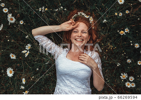 Beautiful young girl with curly red hair in Beautiful young girl with curly red hair in 66269594