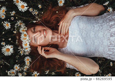 Beautiful young girl with curly red hair in Beautiful young girl with curly red hair in 66269595