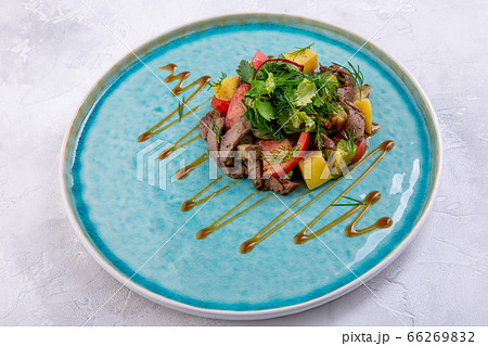 Salad with beef and grilled vegetables. Marble shovel prepared in its own juice, zucchini, fried Salad with beef and grilled vegetables. Marble shovel prepared in its own juice, zucchini, fried 66269832