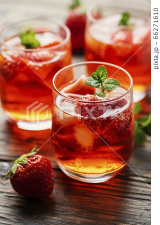 Fresh summer cocktail with ice, strawberry and 66271610