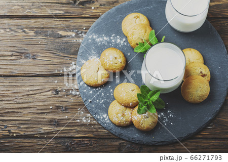 Homemeade cookies with milk on the wooden table Homemeade cookies with milk on the wooden table 66271793