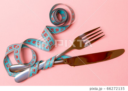 Composition of curled measuring tape, fork and Composition of curled measuring tape, fork and 66272135