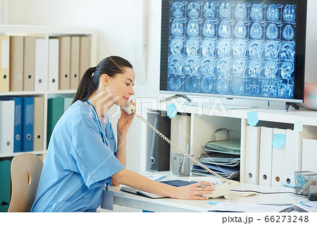 Female Medic Speaking by Phone in Hospital 66273248