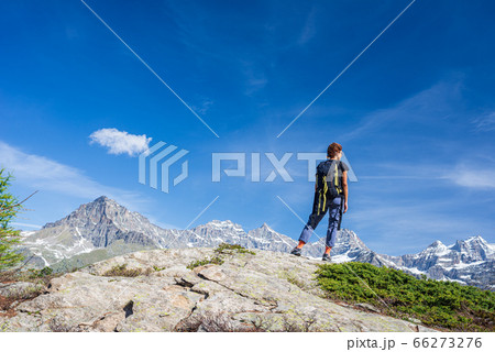 Woman with backpack on mountain top. One person 66273276