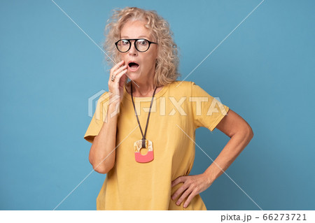 An old caucasian blonde lady expresses shock or surprise An old caucasian blonde lady expresses shock or surprise 66273721