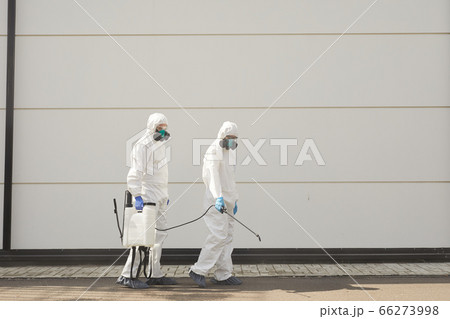 Two Disinfection Workers in Street Two Disinfection Workers in Street 66273998