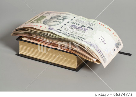 Book with Indian Currency Rupee bank notes 66274773